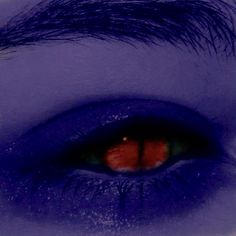 the eye of a person with blue makeup