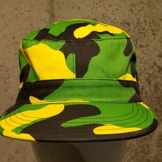 Green Black And Yellow Hat. Sizes Small And Medium. Military Style Hat For Streetwear, Green Military Hat With Curved Brim, Green Military Brimmed Hat, Adjustable Military Cap, Military Camouflage Bucket Hat, Military Style Camouflage Bucket Hat, Military Style Flat Cap For Streetwear, Green Military Bucket Hat With Short Brim, Green Military Bucket Hat