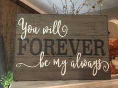 a wooden sign that says you will forever be my alwayss on top of a shelf