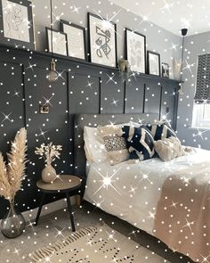 a bedroom decorated in black and white with stars on the wall