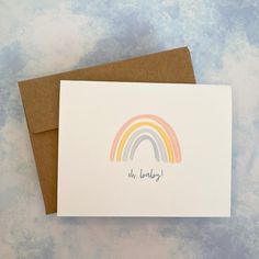 a card with an image of a rainbow on it