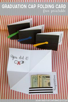 an origami graduation cap folding card is shown with some money in the envelope