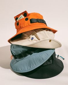 Details Our best-selling bucket hat got an ultra-functional upgrade. Complete with two cargo pockets and carry loops for keeping your essentials close by and hands free. Perfect for sunny days, rainy days, and everything in between. 100% GOTS-certified organic cotton 2.75" brim width, 3" crown height, 23" circumference One size fits most Spot clean Made responsibly in China Male Accessories Aesthetic, Orange Bucket Hat Outfit, Bucket Hat Outfits, Patchwork Bucket Hat, Bucket Hat With String, Bucket Hat Summer, Hats And Caps, United By Blue, Hiking Essentials