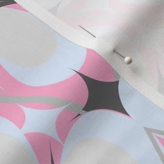 a pink and grey abstract print fabric with buttons