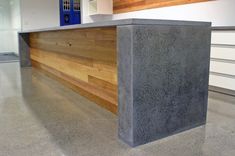 a concrete counter top sitting in the middle of a room