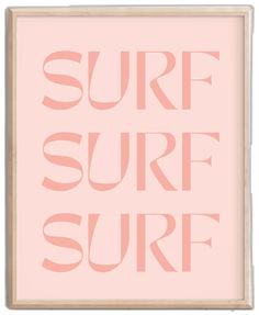 a pink poster with the words surf on it in white and light wood frame, against a pale background