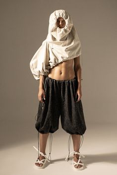 A set of 2 pairs of trousers with gather-able top and bottom edges.These are designed in a way to be transformed into either 2 asymmetric hoodies, or a hoody and trousers set, or 2 types of a dress: an open-shoulder mini or a hooded long sleeve. A demi-version of the set can be worn as either trousers, or a hoody, or an open-shoulder dress, without suit options. Additional information Composition: Cream part: 100% Wool Graphite part: 100% Cotton Care instructions: Dry clean or hand wash cold Iro Open Shoulder Dress, Slow Fashion Movement, Ethical Fashion Brands, Suit Dress, Hooded Dress, Dress Suits, Ethical Fashion