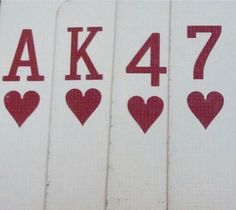 four white towels with red hearts and the number 477 on them are arranged in rows