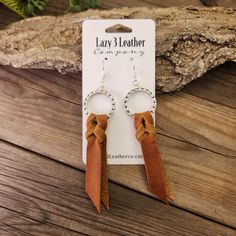 These leather earrings are such a fun shape with their classic saddle knot. They are very lightweight, like all leather earrings, and come in this light tan color. We make all our earrings in our workshop in Ivins Utah and cut everything we make from Full-grain leather hides. These earrings have been finished with Sterling silver, 18K gold, or nickel-free earring hooks and hardware. Braided Leather Earrings Diy, Ivins Utah, Diy Western Jewelry, Leather Earrings Diy, Diy Western, Winter Market, Leather Jewelry Making, Handmade Leather Jewelry, Diy Leather Earrings