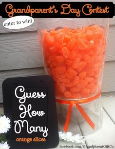 an orange candy bag next to a sign that says grandparent's day contest