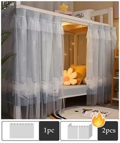 there is a bed with sheer curtains on the top and bottom, along with two pillows