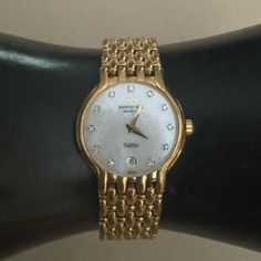 Pre-Owned. Model 4702. Good Condition & Keeps Time Well. 18k Gold Electroplated Case & Strap. Mother Of Pearl Face With Diamond Markers. Original Swiss Movement. Date Function. Raymond Weil, Diamond Watch, Accessories Watches, Mother Of Pearl, Markers, 18k Gold, Women Accessories, The Originals, Gold