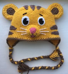 a crocheted hat with a cat's face on it