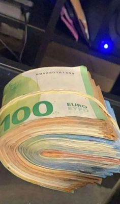 stacks of euro bills are stacked on top of each other