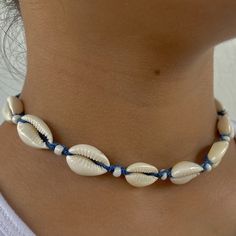 🌊 Dive into Bohemian Elegance! Introducing our Blue Adjustable Cowrie Shell Choker, a vibrant and elegant piece meticulously handcrafted to bring a touch of bohemian chic to your style! This choker is a true reflection of a love for the beach, symbolizing adventure, freedom, and a deep connection with nature. 🏝️ Inspired by the Vibrancy of the Ocean: Crafted with a passion for the vibrant colors of the ocean and the elegance of natural elements, this choker is a celebration of adventure, tranquility, and the timeless beauty of nature. It's a versatile accessory for those who appreciate chic elegance and the lively ambiance of the beach. 🌟 Trendy & Adjustable Design: With its vibrant blue color, adjustable feature, and the timeless appeal of cowrie shells, this choker is a trendy and sop Bohemian Summer Jewelry In Ocean Color, Summer Bohemian Blue Jewelry, Summer Bohemian Ocean Color Jewelry, Summer Bohemian Style Blue Jewelry, Bohemian Blue Jewelry For Summer, Summer Beach Jewelry In Ocean Color, Handmade Ocean Color Jewelry For Summer, Blue Festival Jewelry Ocean-inspired, Ocean Color Jewelry For Summer Beach