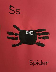 handprinted spider on red paper with the letter s