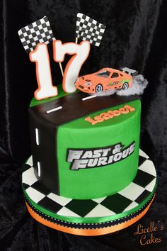 a green and black cake with cars on it