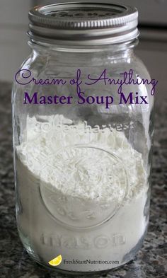 a glass jar filled with white flour on top of a counter