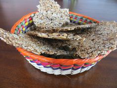 two baskets filled with food sitting on top of a wooden table