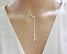 Sterling Silver Lotus and Infinity Lariat Necklace This lariat Y necklace features a lotus flower hanging freely from a sterling cable chain and infinity charm. Select your desired length from the drop down menu, 16, 18, 20, or 22 inches. The lobster clasp and findings are all sterling silver. If you would prefer that the lotus charm is stationary let me know in notes to seller at check out and I will make it so it doesn't move. I typically hang the lotus charm about 2 inches down from the infin Silver Adjustable Lariat Necklace Gift, Delicate Sterling Silver Lariat Necklace For Anniversary, Sterling Silver Lariat Necklace With Long Drop For Gift, Spiritual Silver Lariat Necklace As A Gift, Spiritual Sterling Silver Lariat Necklace Gift, Silver Spiritual Lariat Necklace As Gift, Adjustable Sterling Silver Lariat Necklace For Spiritual Style, Elegant Heart-shaped Lariat Necklace For Anniversary, Nickel-free Metal Lariat Necklace Gift