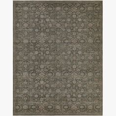 a rug with an intricate design in grey tones