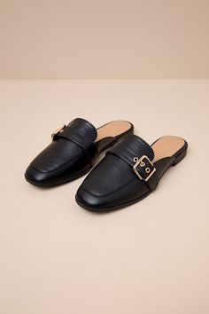 Upgrade your everyday flats with a chic new option like the Lulus Marquete Black Buckle Mule Slides! These too-cute mules have a smooth, faux leather construction that shapes an almond toe upper with a gold buckle strap and matching grommets. Classic notched collar leads to a slide-on design for effortless styling. 0. 75" rubber heel. Cushioned insole. Rubber sole has nonskid markings. Man made materials. Imported. Lulus | Marquete Black Buckle Mule Slides | Size 10. Black Leather Mules Outfit, Trendy Flat Heel Mules With Buckle Closure, Spring Flat Mules With Buckle Closure, Closed Toe Mules With Buckle For Work, Closed Toe Mules With Buckle Closure For Work, Fall Slip-on Mules With Buckle Closure, Fall Buckle Closure Slip-on Mules, Flat Mules With Buckle Closure For Work, Gold Mules With Buckle Closure For Spring