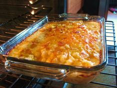 a casserole dish sitting on top of an oven rack in front of the stove