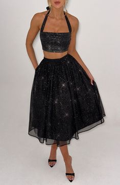 Oh, she's sparkly! You won't find any better than our signature sparkle mesh, a super soft fabric that feels as good as it looks. The Alani skirt is complemented with a full, gathered skirt made with tulle for that extra voluminous look. Make it a dreamy style match with the Alani midi and crop top. 



Colour: Black Sparkle.

Soft sparkle mesh with stretch.

Fully lined.

Full, gathered skirt with tulle for extra volume.

Gathered waistband.

Invisible zipper fastening.

Midi length.

Model is an XS and is wearing an XS.

 Size: XS, S, M, L, XL, XXL Homecoming Dresses Corset, Midi Dress Wedding Guest, Dreamy Style, Gathered Fabric, Long Sleeve Homecoming Dresses, Homecoming Dresses Long, Maxi Dress Sale, Sparkle Dress, Straight Neckline