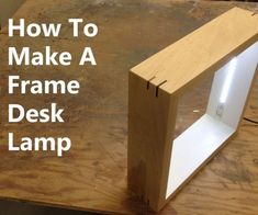 a wooden desk with the words how to make a frame desk lamp on it's side