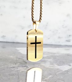 《《  THE PENDANT COLLECTION  》》 THE DETAILS The "GOLD CROSS TAG" Necklace is designed with an exquisitely detailed Matte Gold Stainless Steel Dog Tag Pendant, intricately engraved with a Black Cross, suspended from a Gold Stainless Steel Box Chain available in your choice of length!  💠🔶️💠View our entire PENDANT COLLECTION here: https://www.etsy.com/shop/MrMacKJewelry?ref=ss_profileFref§ion_id=30638859 MATERIALS * 1 1/4" × 3/4" Matte Gold Stainless Steel Black Cross Dog Tag Pendant  * 3mm Gold Gold Adjustable Chain Jewelry For Father's Day, Father's Day Gold Jewelry With Adjustable Chain, Gold Dog Tag Jewelry For Father's Day, Gold Dog Tag Necklace For Father's Day, Father's Day Gold Dog Tag Jewelry, Gold Cross Necklace For Father's Day, Mens Silver Chain Necklace, Necklace Length Chart, Dog Tag Pendant