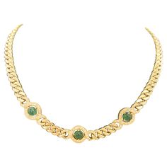 Emerald and Diamond Vintage Cuban Link Necklace in 18K Yellow Gold Indulge in the allure of timeless elegance with this exquisite Emerald and Diamond Vintage "Cuban Link" Necklace. Crafted from luxurious 18K yellow gold, this piece embodies a blend of classic sophistication and modern glamour. The 16 3/4-inch necklace showcases an opulent Cuban link chain that gracefully contours the neckline, making it an unforgettable centerpiece for any attire. This necklace is adorned with three mesmerizing Luxury Yellow Gold Emerald Clavicle Necklace, Gold Necklace 1stdibs, Cuban Link Necklace, Cuban Link, Emerald Diamond, Vintage Diamond, Link Necklace, Luxury Jewelry, Chains Necklace