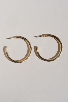 An exploration of technique, shape, and movement, these hollow cut hoops offer an organic simple and lightweight design perfect for everyday, anytime, anywhere. Gold Vermeil (14k gold over sterling silver) made with recycled materialsCARE: Most metals will naturally patina over time, however, there are measures you can take to prolong the life of your jewelry. We recommend removing all jewelry prior to showering, swimming, cleaning, or applying lotions or oils. If your jewelry begins to appear a Everyday Yellow Gold Recycled Hoop Earrings, Everyday Yellow Gold Hoop Earrings From Recycled Gold, Everyday Yellow Gold Hoop Earrings In Recycled Gold, Everyday Hammered Yellow Gold Jewelry, Minimalist Single Hoop Earring In Recycled Gold, Minimalist Everyday Earrings In Recycled Gold, Everyday Minimalist Earrings In Recycled Gold, Modern Everyday Earrings Made From Recycled Gold, Modern Everyday Earrings In Recycled Gold