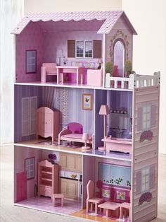 a doll house with furniture and accessories inside