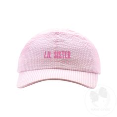 Get your little one ready to be the cutest "LIL SISTER" around with this pink seersucker ball cap! The "wee stitch" embroidery adds a playful touch to this accessory. Perfect for any outing, this cap will have your baby girl looking adorable while keeping her head protected. Cotton/poly blend. Playful Cotton Baseball Cap For Spring, Playful Pink Cotton Baseball Cap, Pink Cotton Baseball Cap For Summer, Cute Pink Cotton Hat, Pink Cotton Summer Baseball Cap, Pink Cotton Hat With Embroidered Logo, Pink Cotton Dad Hat For Spring, Pink Baseball Cap With Embroidered Logo, One Size, Pink Cotton Baseball Cap, One Size