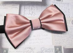 "Beautiful silk pre tied and adjustable double tiered banded bow tie. Will adjust from 13\" through 20\" neck. Bow dimensions 2.5\" x 4.5\"." Elegant Pink Adjustable Bow Tie, Elegant Adjustable Pink Bow Tie, Pink Satin Bow Tie For Black Tie Events, Elegant Pink Bow For Black Tie Events, Classic Black Ribbon Bow Tie For Wedding, Pink Bow Tie For Black Tie Events, Elegant Pink Bow Tie For Black Tie Events, Black Bow Tie, Gents Fashion