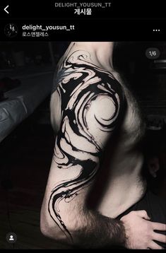 a man's arm is covered in black ink and has swirls on it