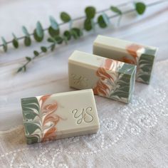 three soap bars sitting on top of a table