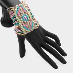 Introducing the Boho Seed Beaded Cuff Stretch Bracelet—a gorgeous and unique piece that captures the essence of bohemian style. This 1.5" high cuff is intricately crafted with vibrant seed beads, forming a stunning pattern that wraps your wrist in an explosion of color and texture. The stretchable design ensures a comfortable fit for all wrist sizes, while the handcrafted quality speaks to its origins in India, where skilled artisans bring each piece to life. Perfect for adding a touch of boho-c Formal Necklace, Formal Earrings, Formal Accessories, Pearl Jewelry Necklace, Beaded Cuff, Small Earrings, Necklace Earring Set, Stretch Bracelet, Stretch Bracelets