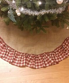 a christmas tree skirt hanging from the side of a christmas tree