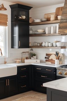 the kitchen is clean and ready for us to use it's black cabinetry