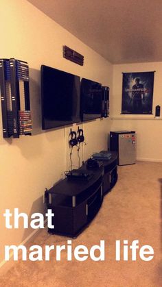 a living room filled with furniture and flat screen tvs mounted on the wall next to each other