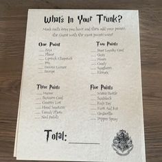 a harry potter trinket is sitting on a table with the words, what's in your trunk?