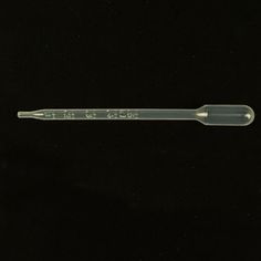 an empty plastic toothbrush on a black background