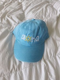 a baby blue classic baseball cap with “aloha” embroidered in yellow on the front! one size fits most, adjustable back Cute Beach Hat, Summer Dad Hat One Size, Summer Dad Hat One Size Fits Most, Summer Dad Hat, Adjustable Blue Summer Baseball Cap, Adjustable Curved Visor Baseball Cap For Vacation, Cute Hats Aesthetic, Vacation Baseball Cap With Curved Visor, Curved Visor Baseball Cap One Size For Vacation