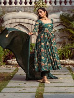 This Set Has a Anarkali, bottom and dupatta. Floral printed Anarkali set with gotta Patti handwork on neck and sleeves paired with matching chanderi foil print dupatta enhanced with fabric detailing and palazzo pants. Color: Green Fabric: Anarkali - Cotton Silk Bottom - Shantoon Dupatta - Chanderi Product Details: Neck Type - Round neck Anarkali Length - 50 inches Bottom Length - 38-40 inches Sleeve Length - 22 inches Note: Available in other colors The product will be delivered within 2-4 weeks Chanderi Sets With Printed Motifs, Floor-length, Designer Cotton Silk Anarkali Set With Printed Motifs, Chanderi Anarkali Set With Printed Motifs For Diwali, Diwali Chanderi Anarkali Set With Printed Motifs, Festive Anarkali Set With Printed Motifs For Diwali, Festive Printed Motifs Anarkali Set For Diwali, Diwali Anarkali Set In Mulmul With Printed Motifs, Diwali Mulmul Anarkali Set With Printed Motifs, Designer Chanderi Anarkali Set With Printed Motifs