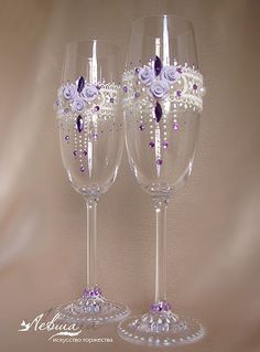 two wine glasses decorated with purple and white flowers