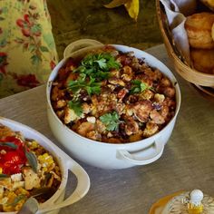 three different types of food are sitting on the table next to each other, including bread and vegetables