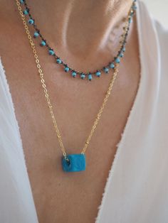 Turquoise necklace, Gold turquoise pendant, Turquoise jewelry, Layered gold necklace, Bridesmaid Necklace, Bridesmaid Gift, Minimalist jewelry, Layering necklace, Tiny Turquoise charm, Howlite gemstone * * * MATERIAL & SIZE * * * - Gold plated chain over 925 sterling silver - - All components are gold plated over sterling silver -Turqoise cube glass bead 4mm x 4mm with hall MATERIALS WE USE AT ALEVIZOU JEWELLERY are sterling silver 925 This lovely dainty charm is a Perfect Necklace for layer Elegant Turquoise Charm Necklaces With Adjustable Chain, Elegant Turquoise Charm Necklace With Adjustable Chain, Blue Gemstone Square Pendant Necklace, Blue Gemstone Necklace With Square Pendant, Elegant Turquoise Crystal Necklaces For Jewelry Making, Turquoise Gemstone Beads Pendant Jewelry, Gemstone Beads Dangle Jewelry Gift, Elegant Wire Wrapped Turquoise Necklace Gift, Blue Square Pendant Jewelry With Gemstone