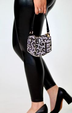 *PRE-ORDER* Items will be shipped 8/15 - 8/17. Get noticed with the Sparkle Rhinestone Pouch Handbag, the perfect bag for your days or nights out on the town. Featuring sparkly rhinestone studs, a top zip closure, an interior pocket, a detachable crossbody chain, and black vegan leather shoulder handle. A stylish any season must have. Designed to hold your daily necessities, such as make-up, keys, and cell phone. Details: Top zip closure Detachable Crossbody Chain Dimensions: 8"(L) x 2.5"(W) x 1 Rhinestone Crossbody Bag For Night Out, Evening Rhinestone Crossbody Bag, Black Evening Bags With Bling, Glamorous Crossbody Bag With Rhinestones, Glamorous Rhinestone Crossbody Bag, Evening Black Bags With Rhinestone Rivets, Chic Rhinestone Pouch Evening Bag, Black Rhinestone Bags For Night Out, Black Clutch Bag With Rhinestones