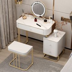 a white vanity table with a stool and mirror on the wall next to it in a room